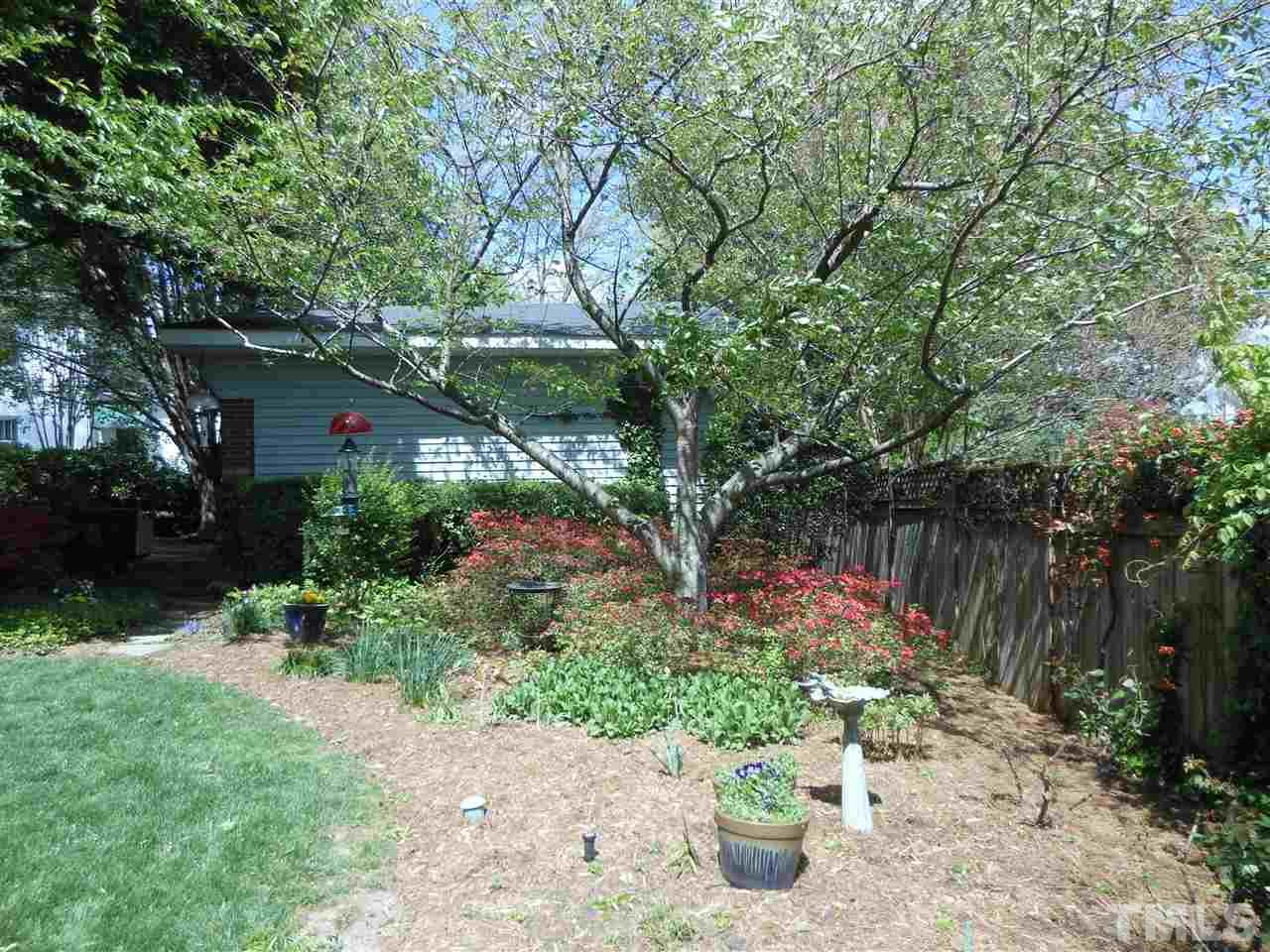 2404 White Oak Road Raleigh, NC 27609 - Photo 11 of 23 a view of a garden with flowers and trees