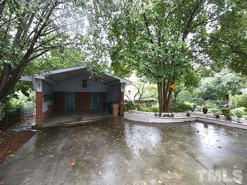 2404 White Oak Road Raleigh, NC 27609 - Photo 20 of 23 a view of a house with a yard and large tree