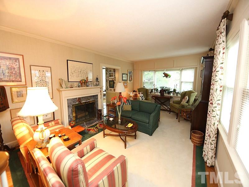 2404 White Oak Road Raleigh, NC 27609 - Photo 3 of 23 a living room with furniture fireplace and a large window
