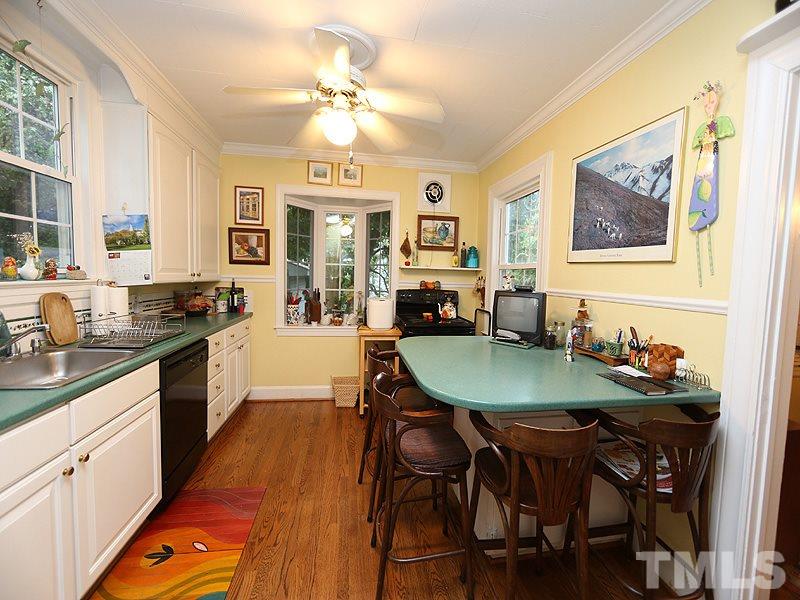 2404 White Oak Road Raleigh, NC 27609 - Photo 6 of 23 a large kitchen with a table and chairs