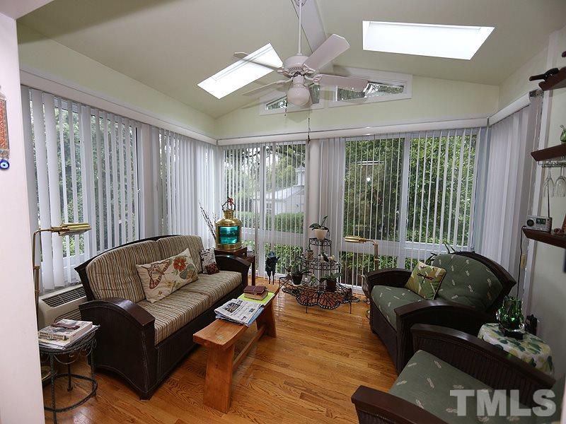 2404 White Oak Road Raleigh, NC 27609 - Photo 8 of 23 a living room with furniture and large windows