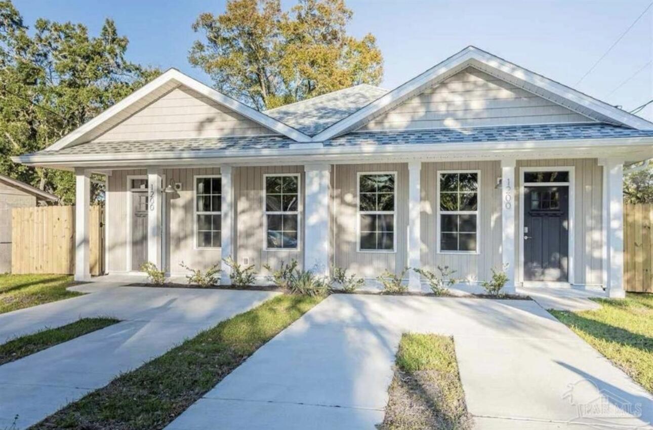 a front view of a house with a yard outdoor seating and yard