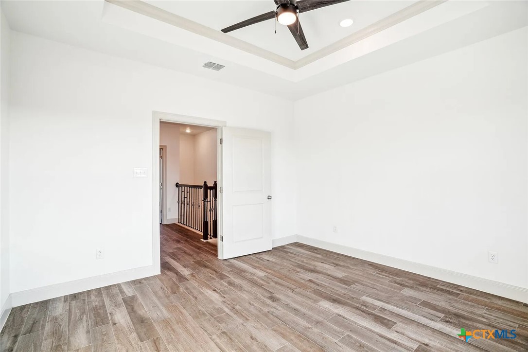289 Star Grass, Unit 3 Spring Branch, TX 78070 - Photo 28 of 40 a view of empty room with wooden floor