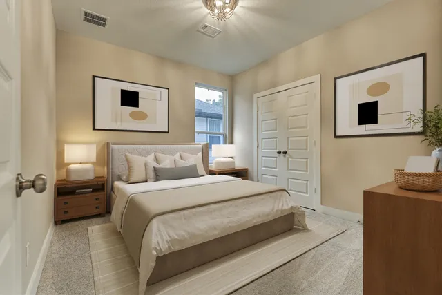 a bedroom with a bed and a chandelier