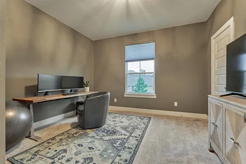 a living room with a couch and a flat screen tv