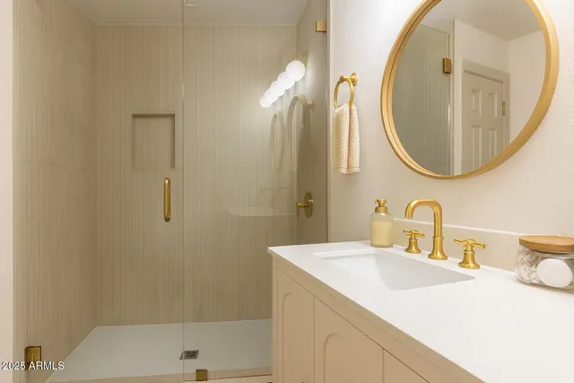 a bathroom with a sink and a mirror