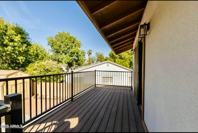 a view of balcony with wooden floor