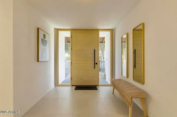 a view of hallway with natural light