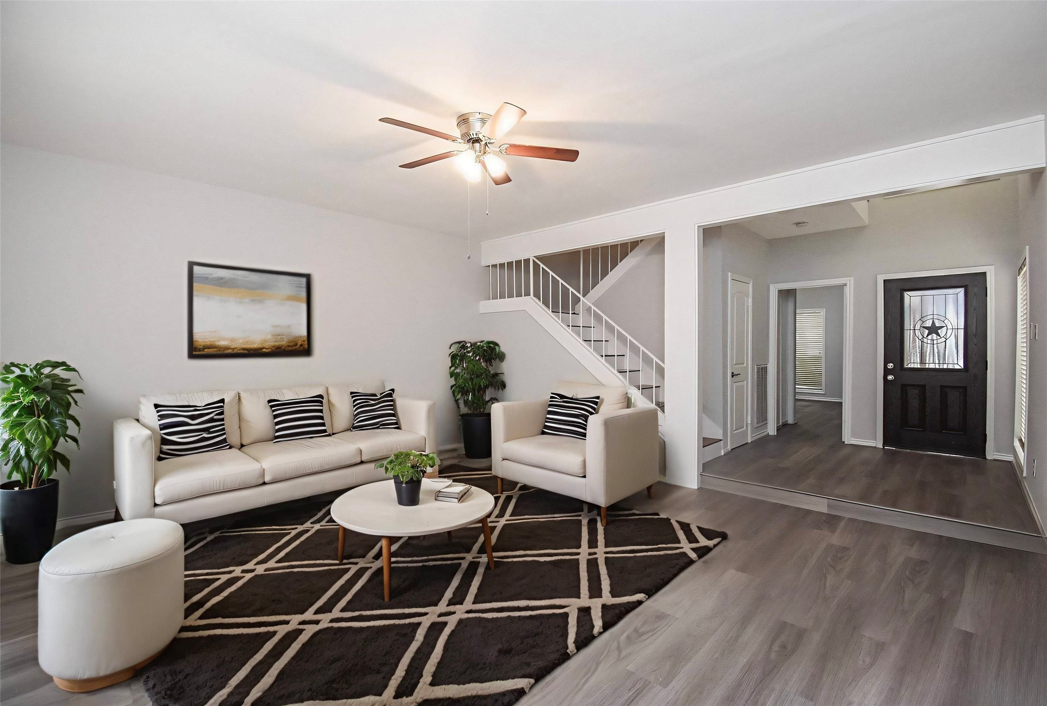 201 Vanderpool Lane, Unit 113 Houston, TX 77024 - Photo 4 of 45 a living room with furniture and wooden floor