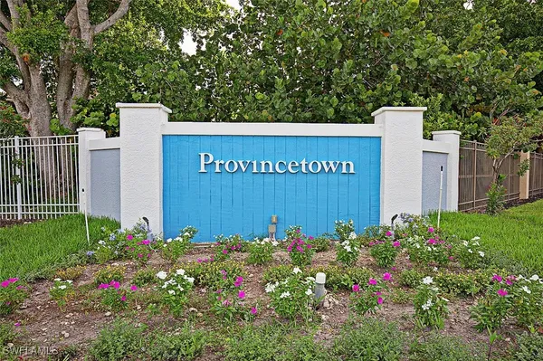 a view of a sign in front of house