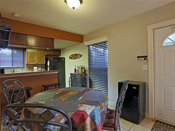 a dining room with furniture and window