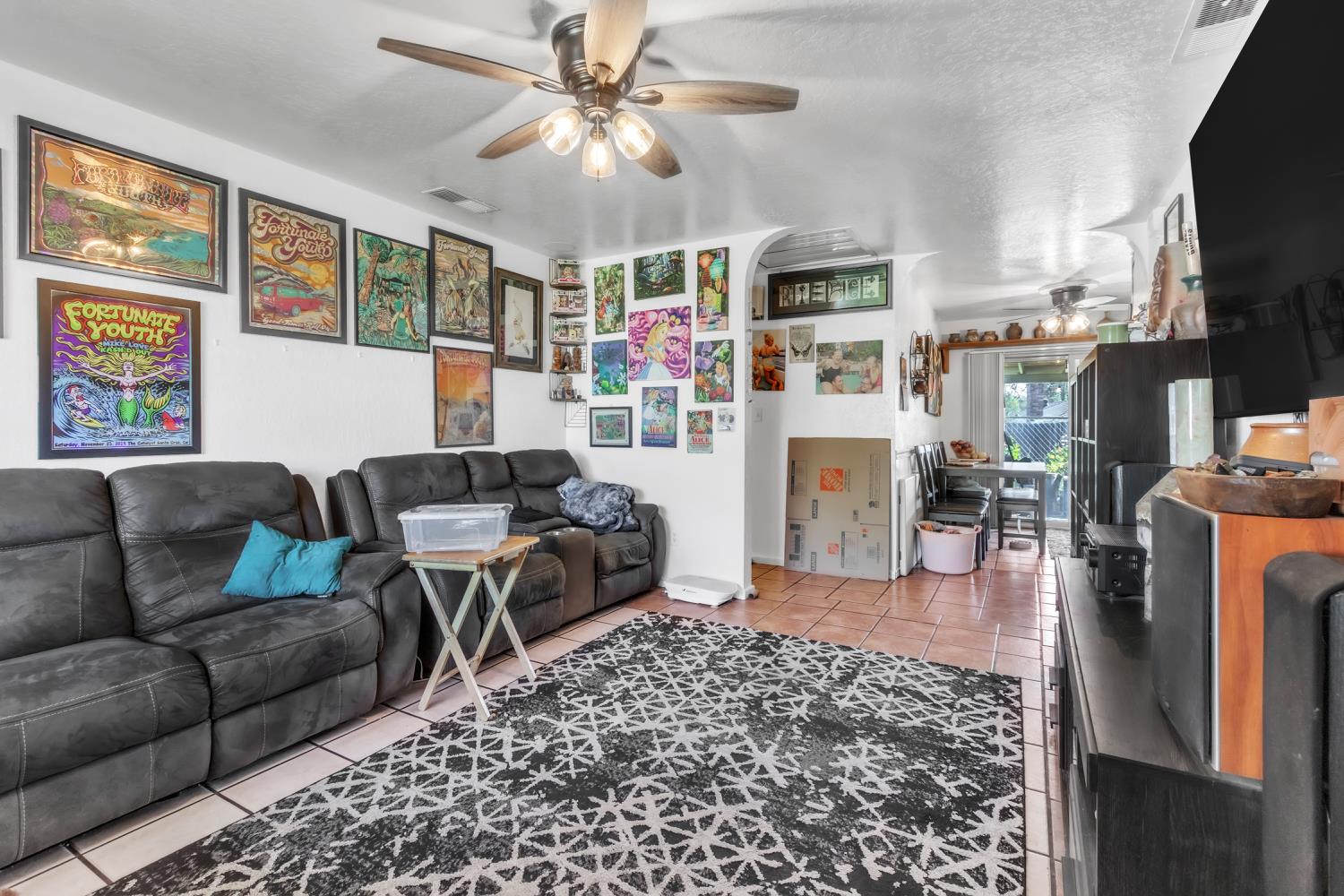 5812 Keyntel Street Citrus Heights, CA 95621 - Photo 5 of 30 a living room with furniture a flat screen tv and a fireplace