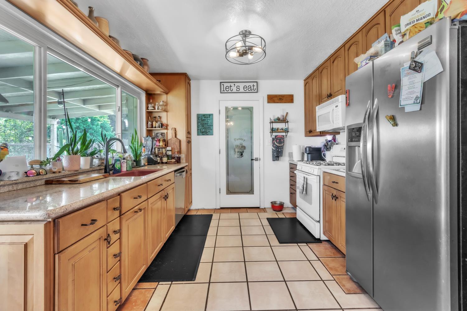 5812 Keyntel Street Citrus Heights, CA 95621 - Photo 7 of 30 a large kitchen with stainless steel appliances a refrigerator and a sink