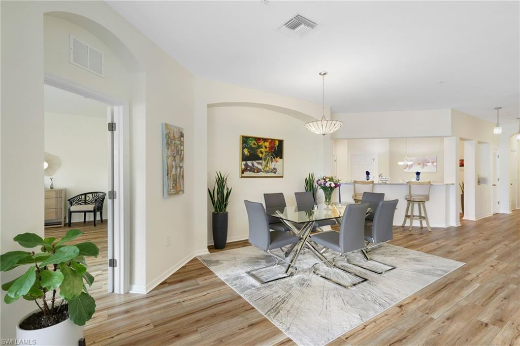 3787 Costa Maya Way, Unit 101 Estero, FL 33928 - Photo 18 of 49 Dining area with light wood-type flooring and baseboards