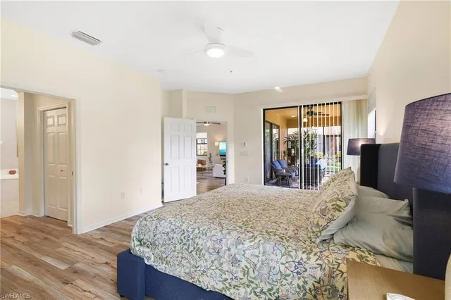 a bedroom with a large bed and a dresser