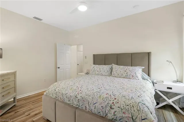 a bedroom with a bed and a dresser