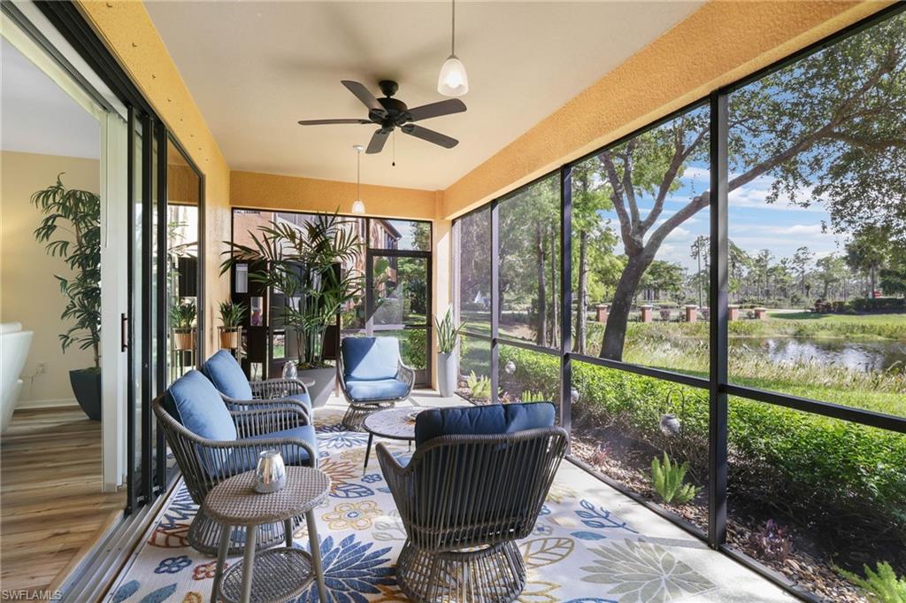 3787 Costa Maya Way, Unit 101 Estero, FL 33928 - Photo 31 of 49 Sunroom / solarium with a ceiling fan and a water view