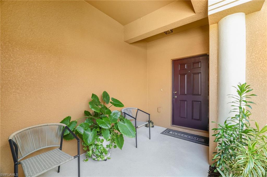 3787 Costa Maya Way, Unit 101 Estero, FL 33928 - Photo 33 of 49 Entrance to property featuring stucco siding