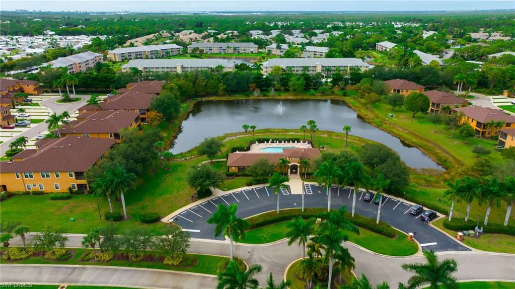 3787 Costa Maya Way, Unit 101 Estero, FL 33928 - Photo 39 of 49 Aerial view of property and surrounding area featuring a nearby body of water
