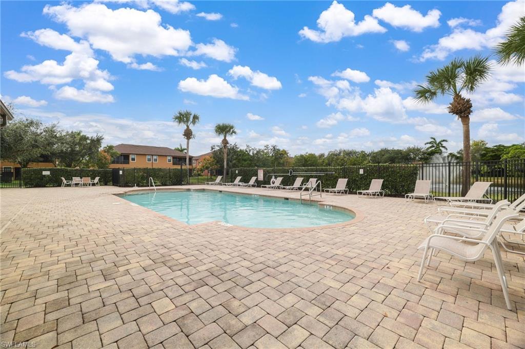 3787 Costa Maya Way, Unit 101 Estero, FL 33928 - Photo 47 of 49 Community pool featuring a patio area