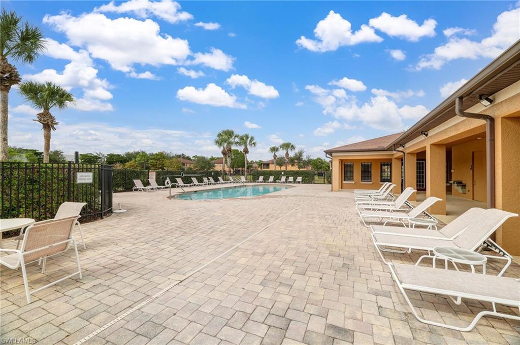 3787 Costa Maya Way, Unit 101 Estero, FL 33928 - Photo 48 of 49 Community pool with a patio area