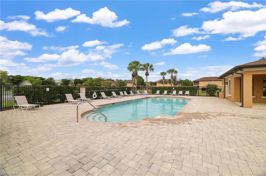 3787 Costa Maya Way, Unit 101 Estero, FL 33928 - Photo 49 of 49 Community pool with a patio