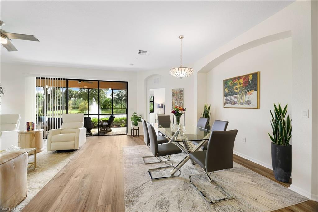 3787 Costa Maya Way, Unit 101 Estero, FL 33928 - Photo 7 of 49 Dining space featuring light wood finished floors and baseboards