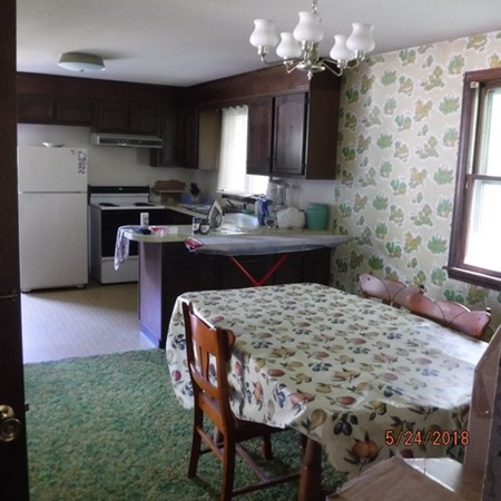 13 Briarwood Road Rutland, MA 01543 - Photo 7 of 19 a kitchen with a table and chairs in it