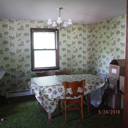 13 Briarwood Road Rutland, MA 01543 - Photo 8 of 19 a bed sitting in a bedroom next to a window with a chandelier