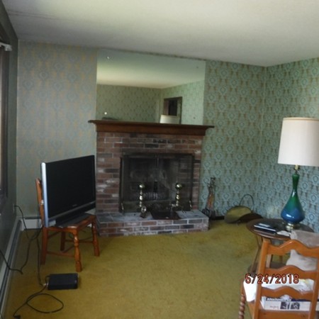 13 Briarwood Road Rutland, MA 01543 - Photo 10 of 19 a living room with furniture and a fireplace