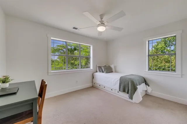 a bed room with a bed and a window