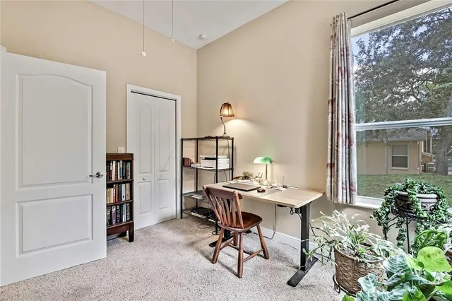 a bedroom with a bed and a desk