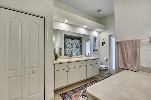 a bedroom with a bed and a desk