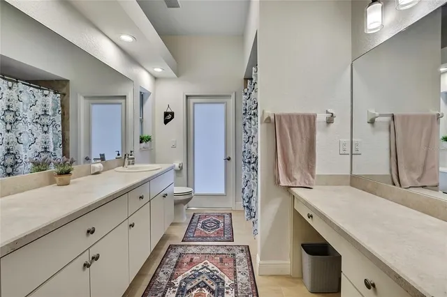 a utility room with sink dryer and washer