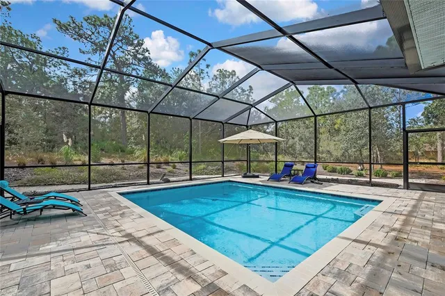 a backyard of a house with plants and trees