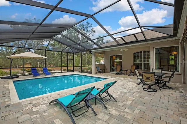 a view of a swimming pool with a patio