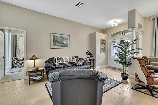 a view of a dining room with furniture and chandelier