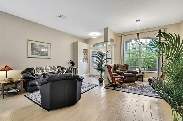 a kitchen with stainless steel appliances granite countertop a stove refrigerator and a microwave