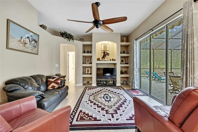 a kitchen with stainless steel appliances granite countertop a sink and cabinets with wooden floor