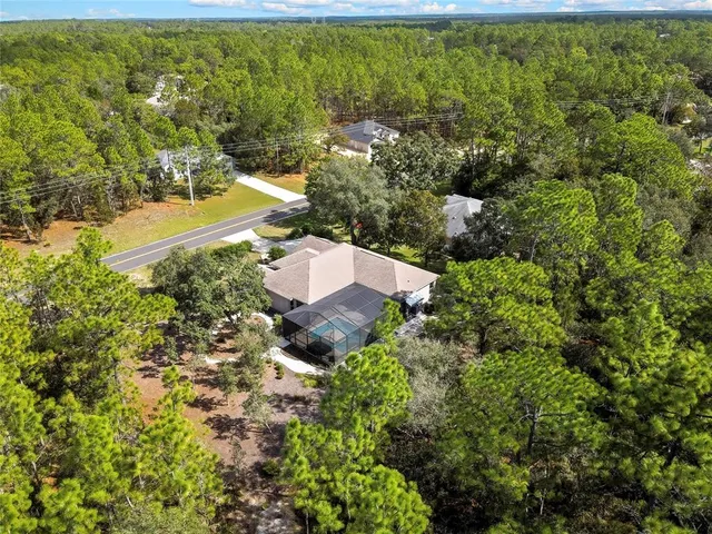 an aerial view of residential house with outdoor space