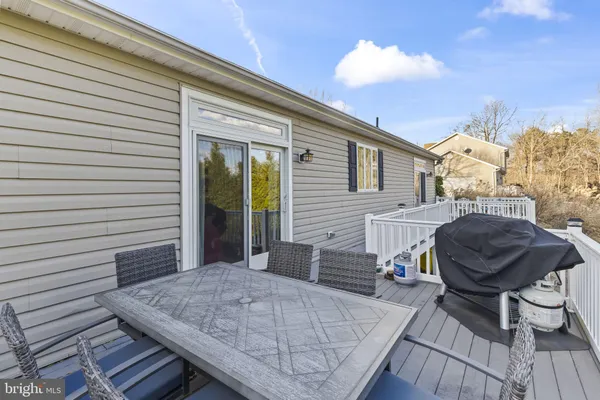 a view of a deck with furniture