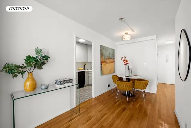 a dining room with furniture and wooden floor