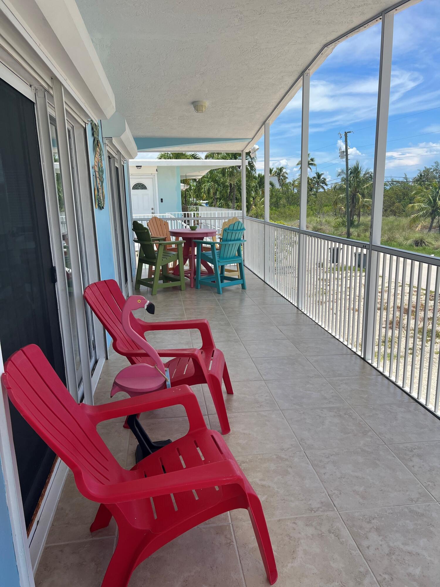 16 Shoreland Drive Key Largo, FL 33037 - Photo 2 of 16 a view of a balcony with chairs
