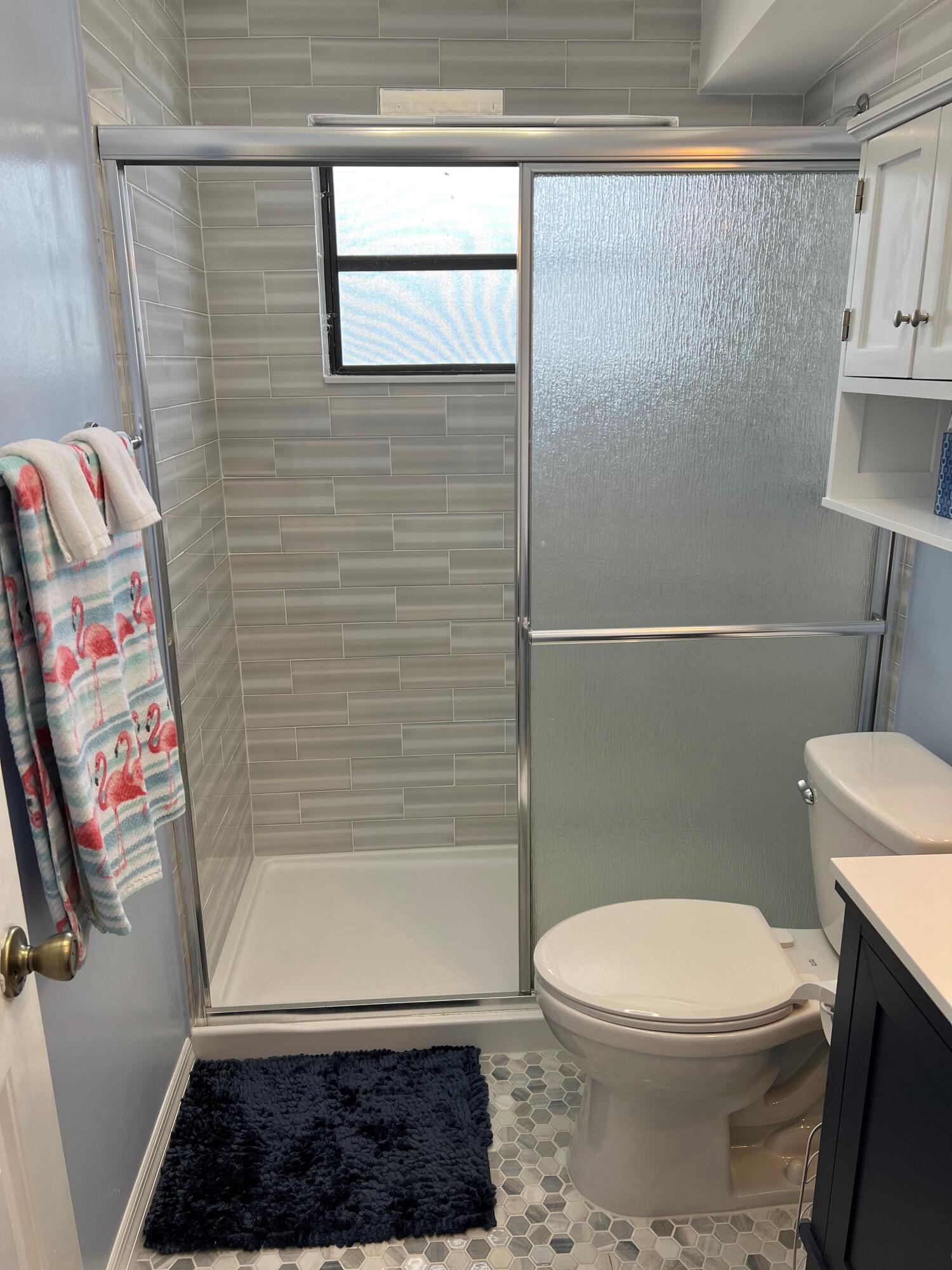 16 Shoreland Drive Key Largo, FL 33037 - Photo 9 of 16 a bathroom with a toilet and a shower