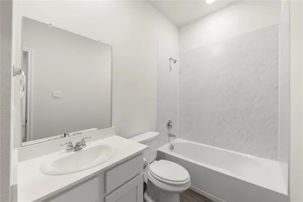 a view of hallway with wooden floor