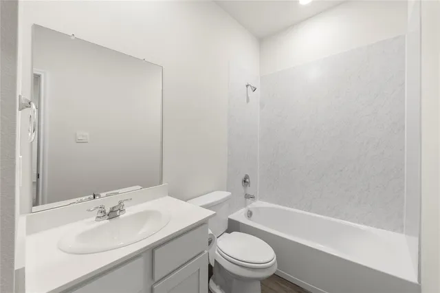 a view of hallway with wooden floor