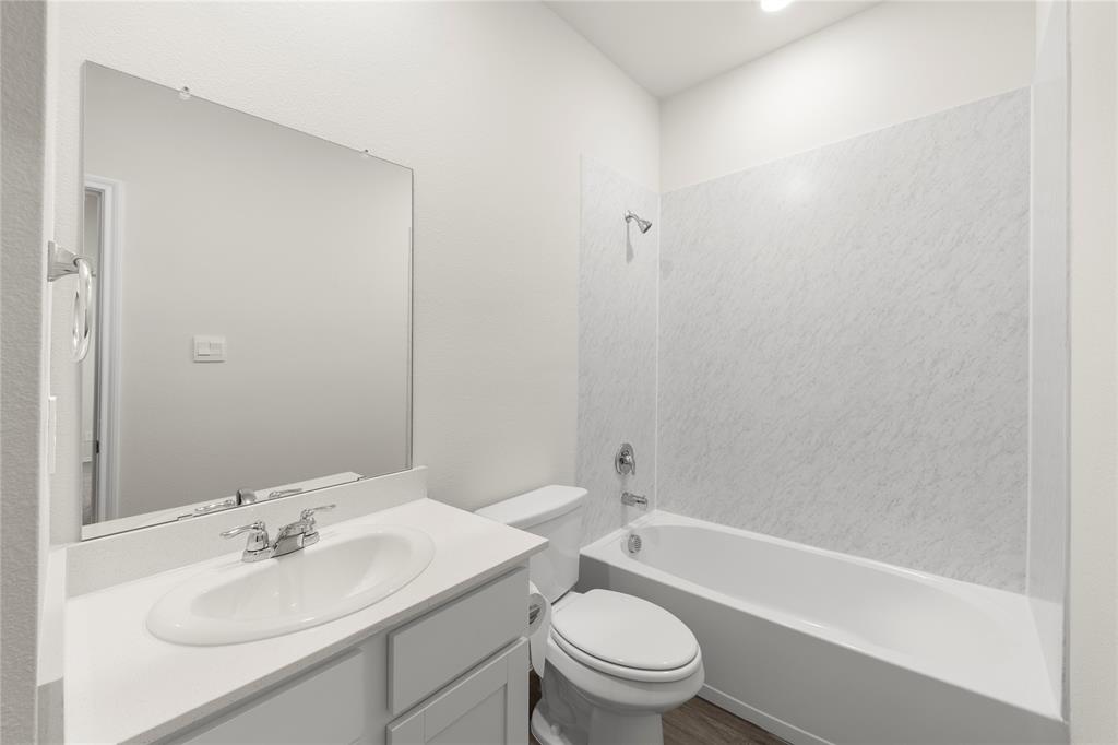 3400 Rendezvous Way Sherman, TX 75090 - Photo 9 of 17 a bathroom with a sink toilet and a bathtub