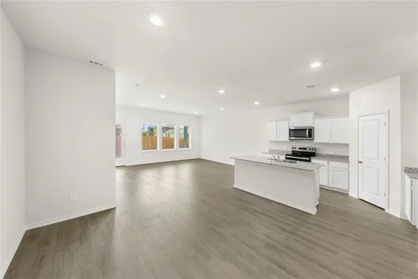 a backyard of a house with large trees