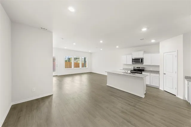 a backyard of a house with large trees