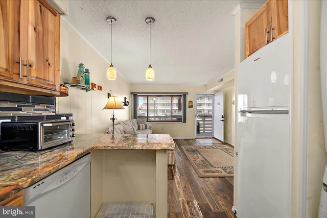 a bedroom with a bed and cabinet